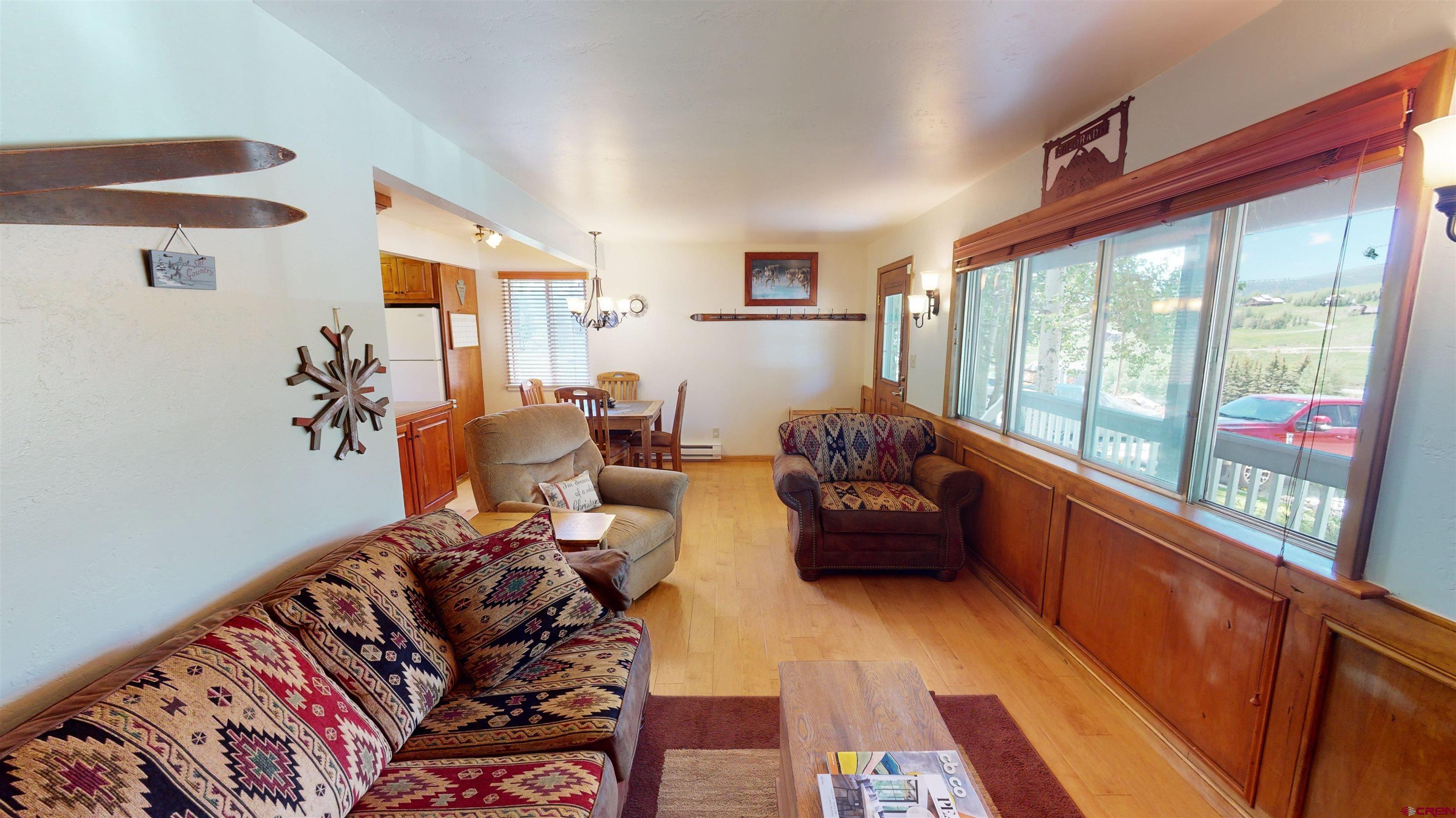 18 Crystal Road, Unit 3B Crested Butte, CO 81225 - Photo 3 of 20 a living room with furniture and a large window