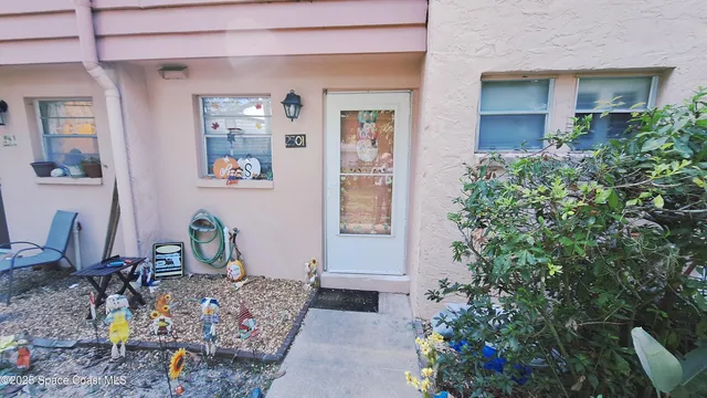 a backyard of a house with outdoor seating