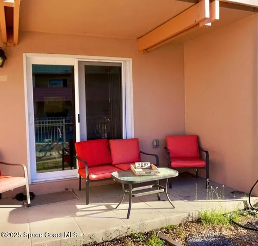 a view of balcony with deck and outdoor seating