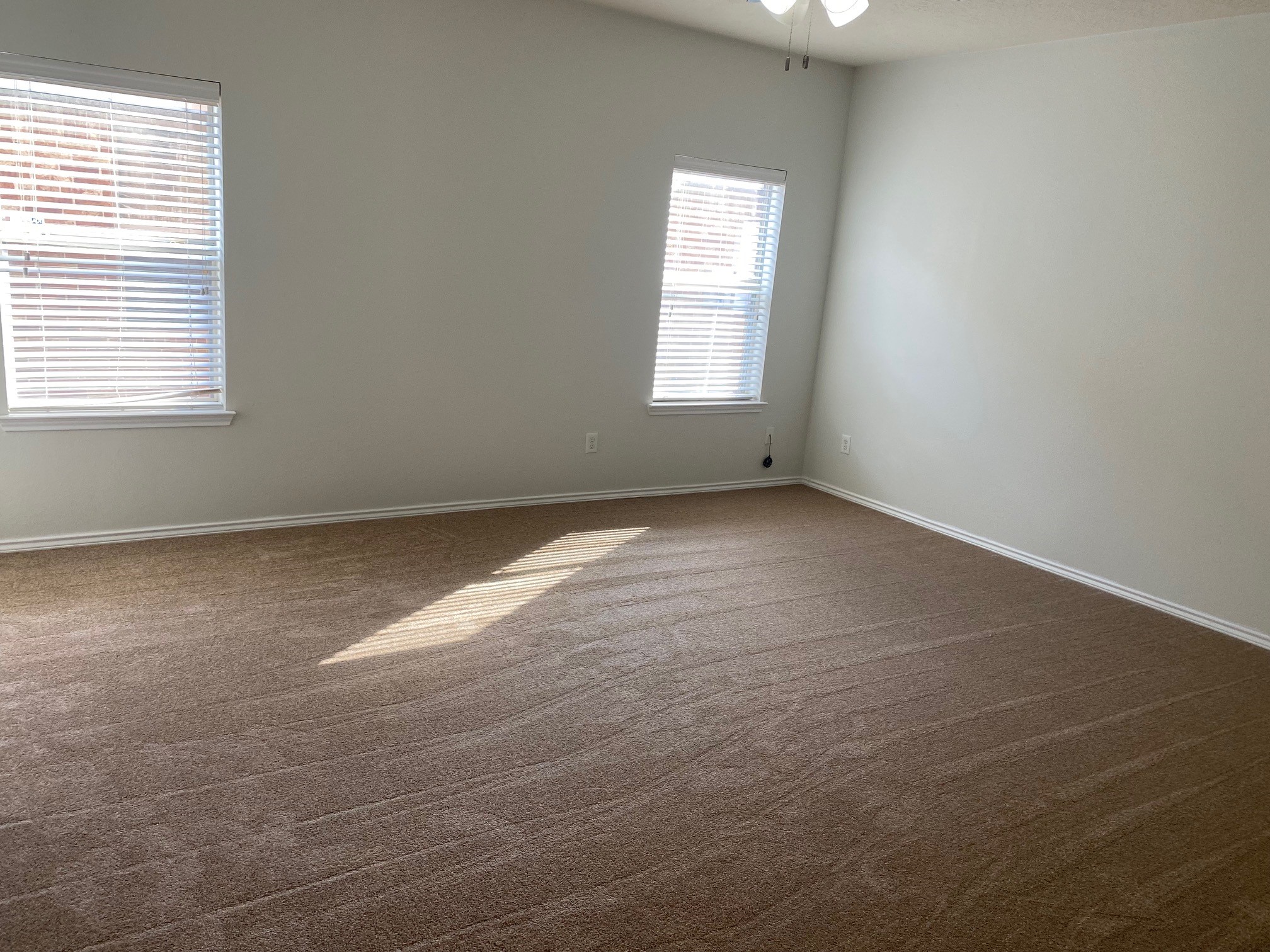 21218 Branchport Drive Houston, TX 77095 - Photo 5 of 18 an empty room with windows