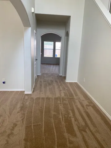 a view of an empty room and window