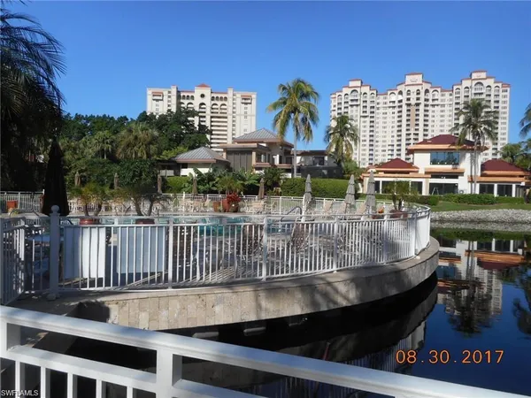 a view of a balcony with sitting area