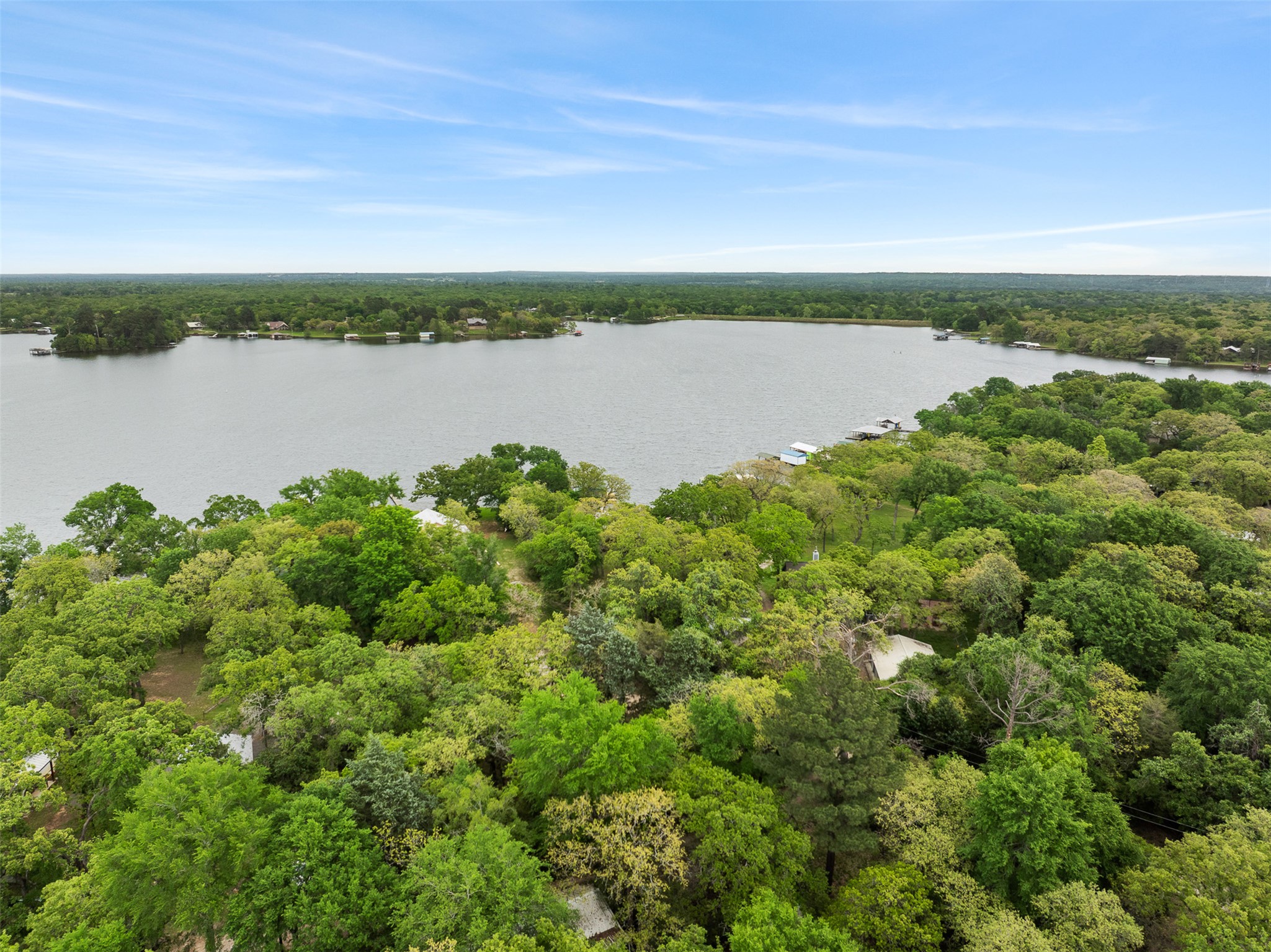 10959 Clyde Acord Road Franklin, TX 77856 - Photo 31 of 39 a view of a lake with houses in the back