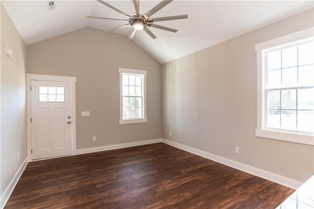 407 Green Street Roxboro, NC 27573 - Photo 6 of 14 wooden floor in an empty room with a window