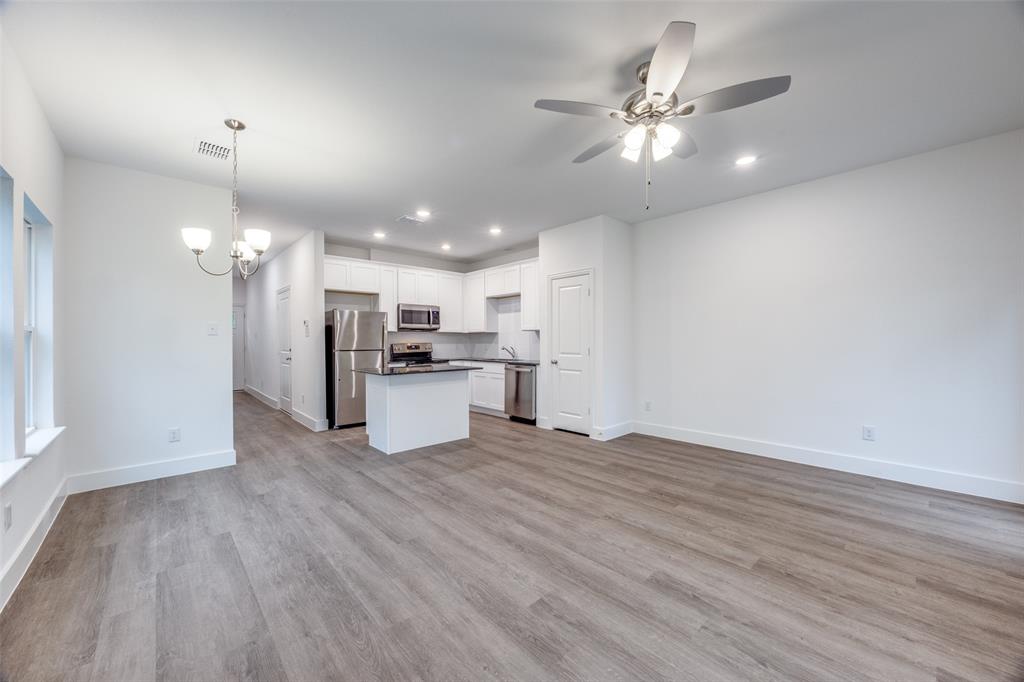 412 East 7th Street, Unit 2 Bonham, TX 75418 - Photo 12 of 12 a view of kitchen with cabinets and wooden floor