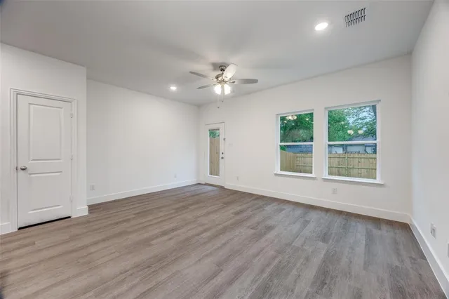 a view of kitchen with cabinets and wooden floor