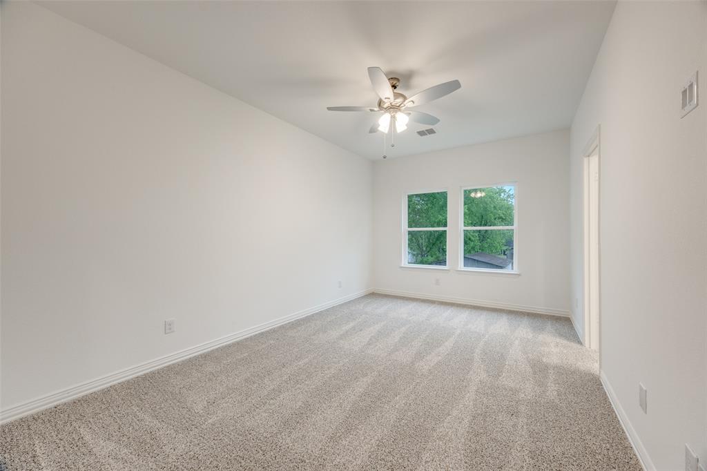 412 East 7th Street, Unit 2 Bonham, TX 75418 - Photo 6 of 12 a view of an empty room with a window