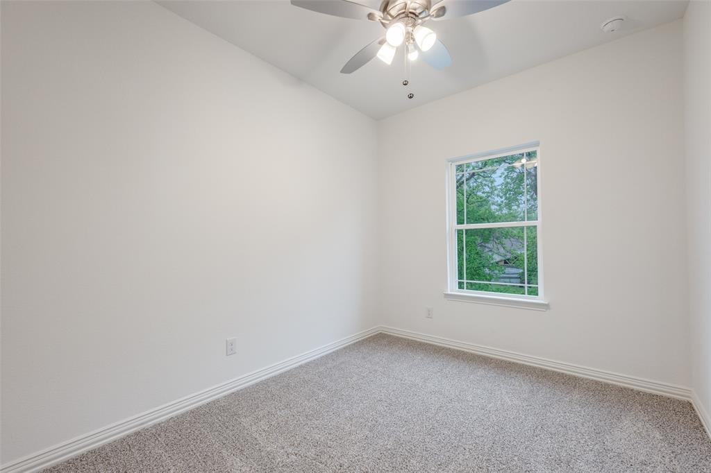 412 East 7th Street, Unit 2 Bonham, TX 75418 - Photo 8 of 12 an empty room with a window