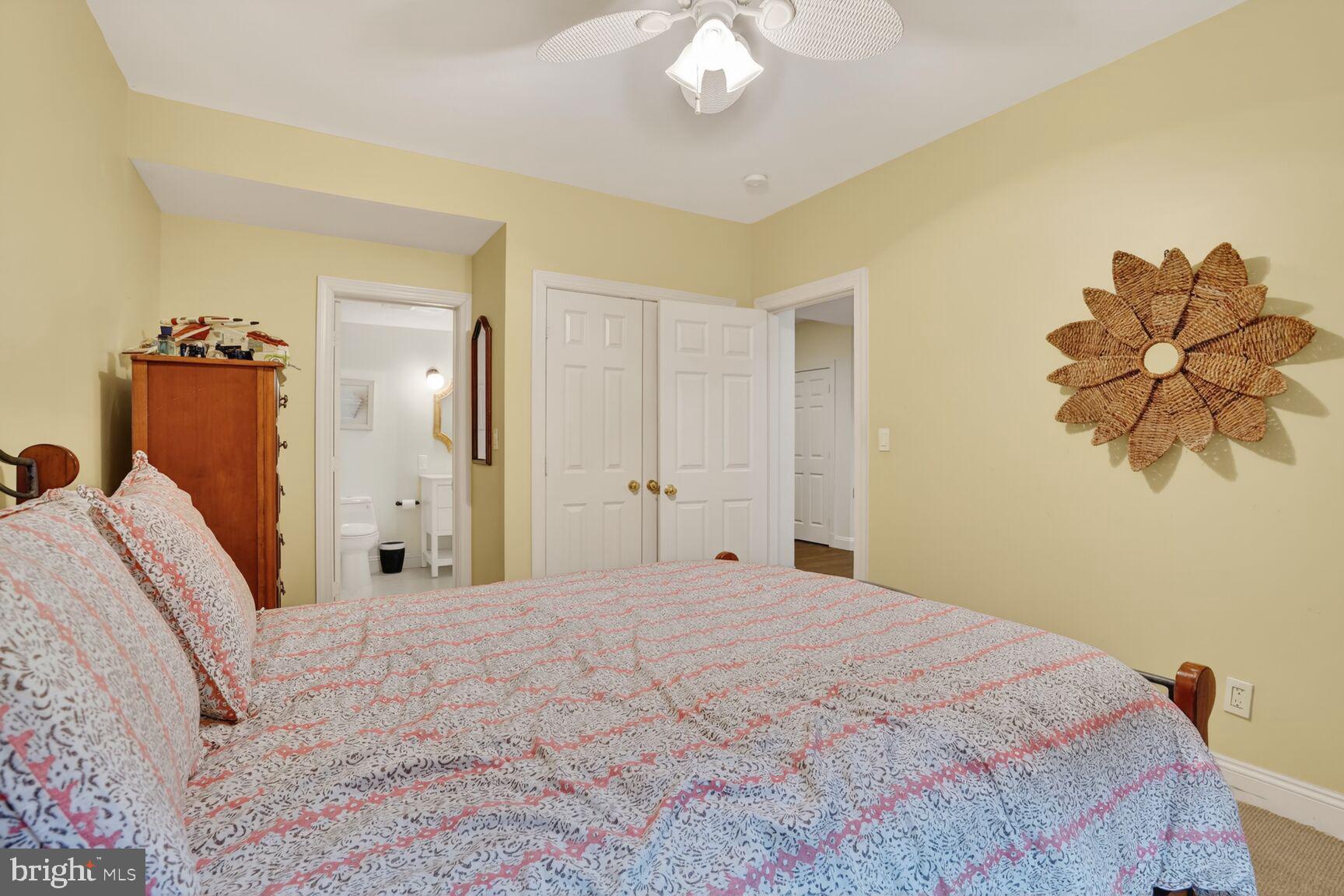 4837 W Street Northwest Washington, DC 20007 - Photo 44 of 51 a bedroom with a bed and a chandelier