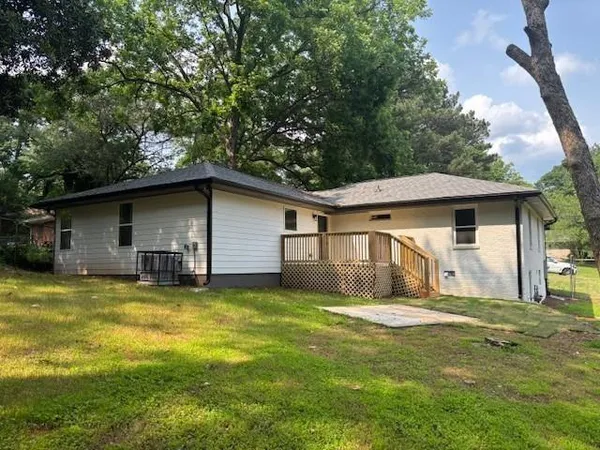 a house that has a big yard in front of it