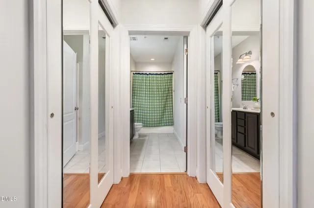 a view of a bathroom from a hallway