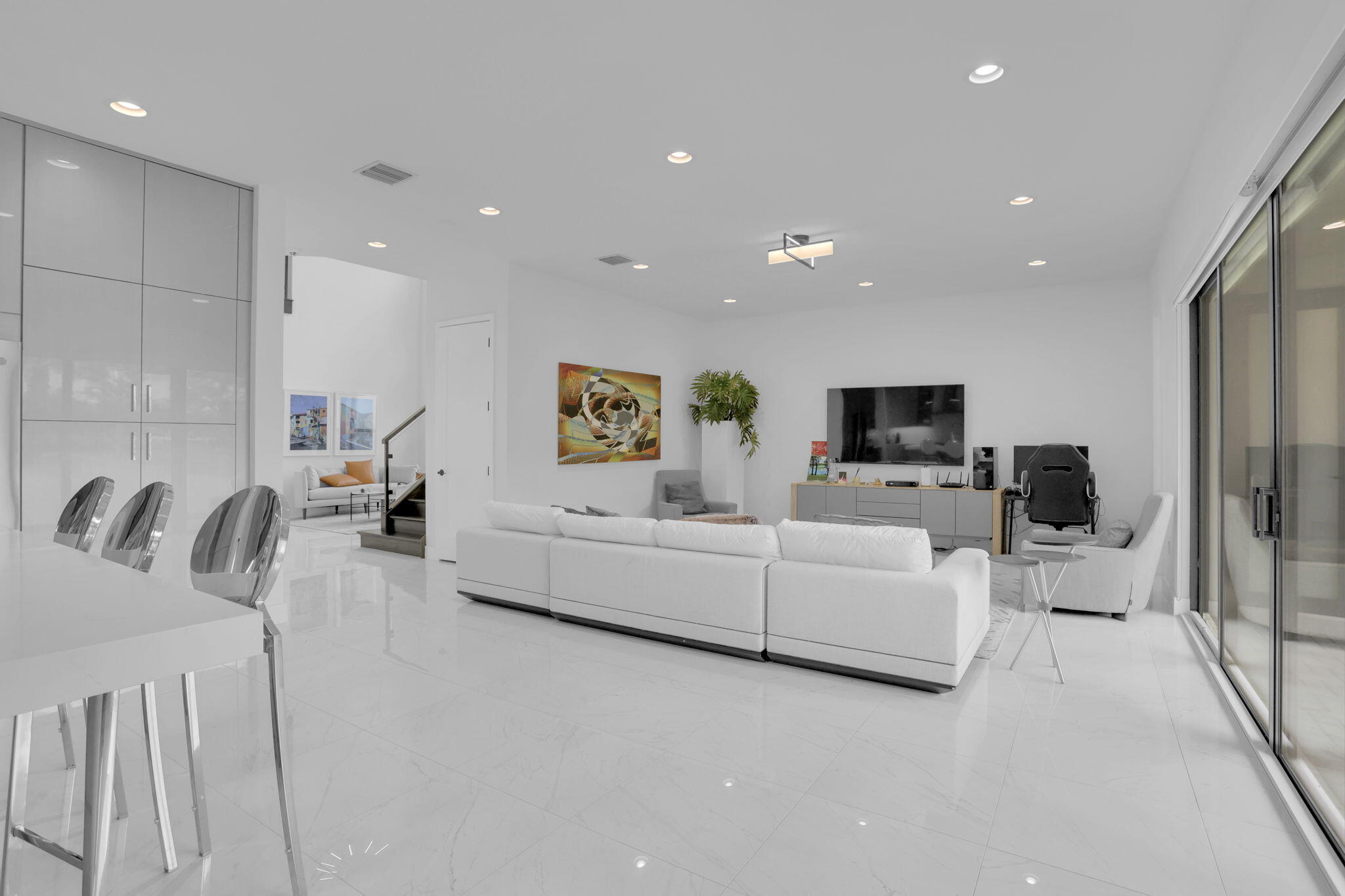 8115 Laurel Falls Drive Boca Raton, FL 33496 - Photo 15 of 74 a living room with furniture and a flat screen tv
