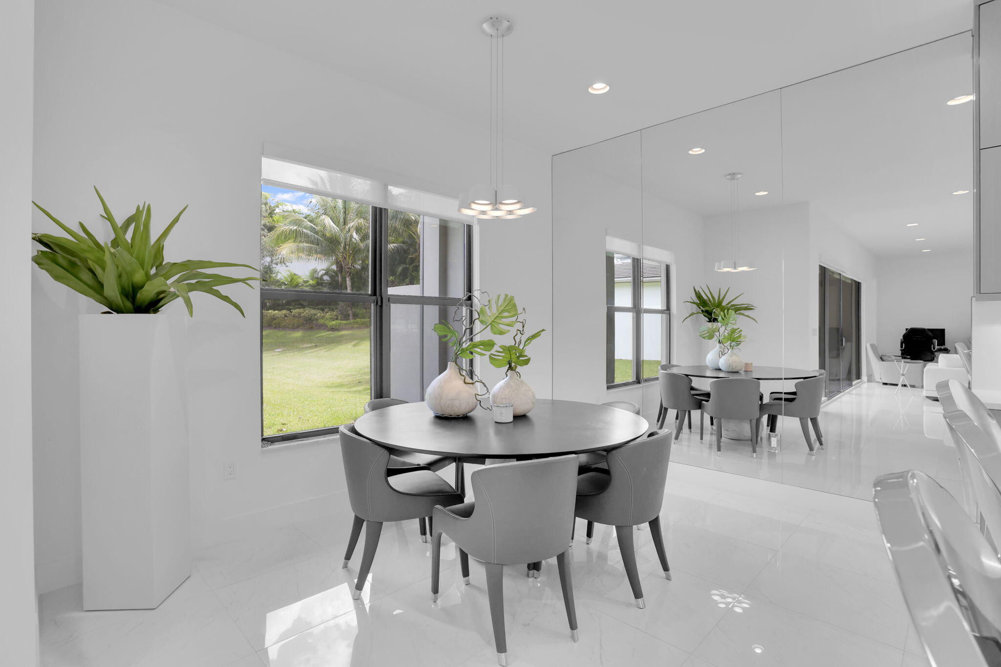 8115 Laurel Falls Drive Boca Raton, FL 33496 - Photo 16 of 74 a view of a dining room with furniture and a potted plant