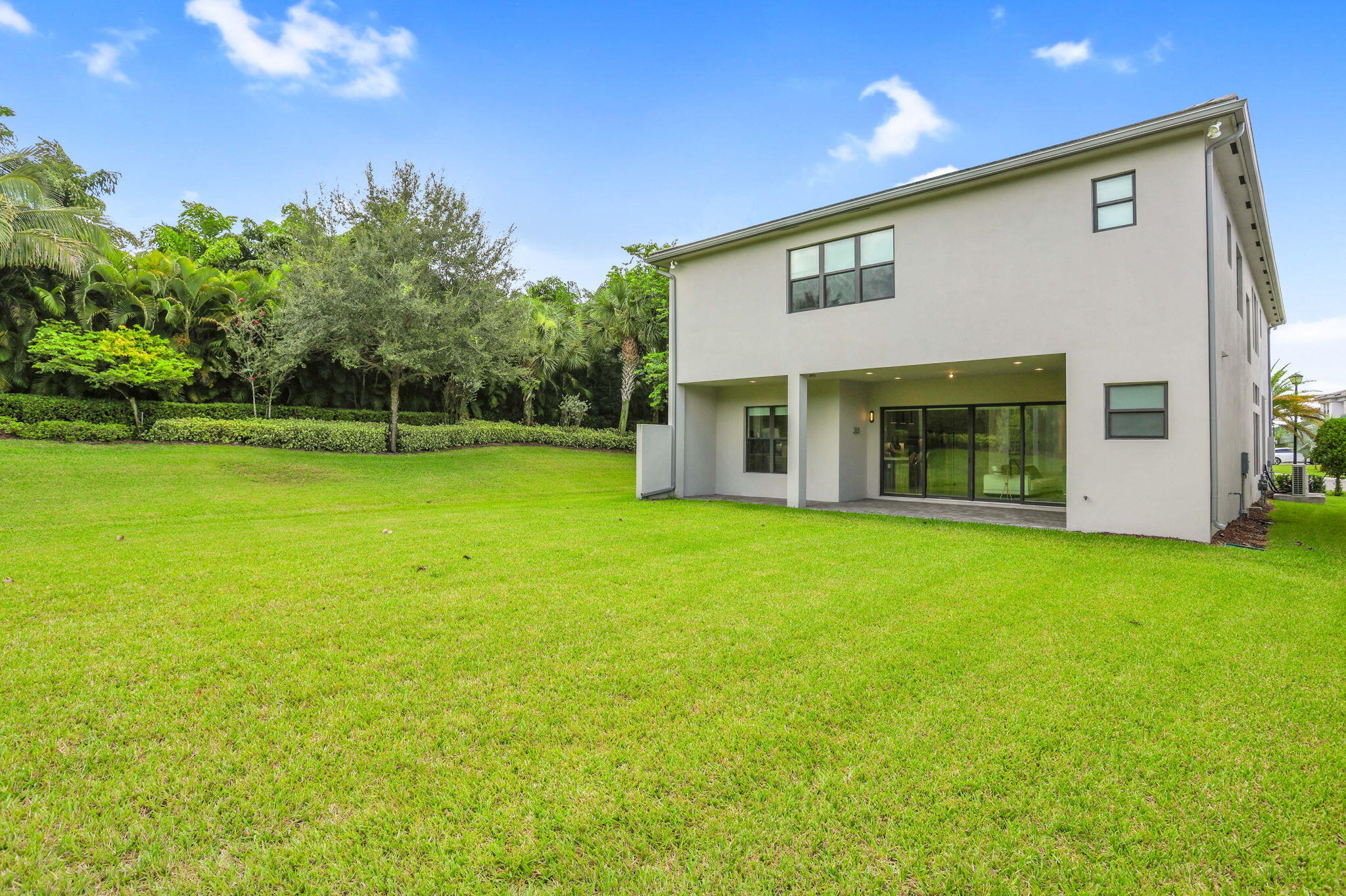 8115 Laurel Falls Drive Boca Raton, FL 33496 - Photo 28 of 74 a view of a house with backyard and garden