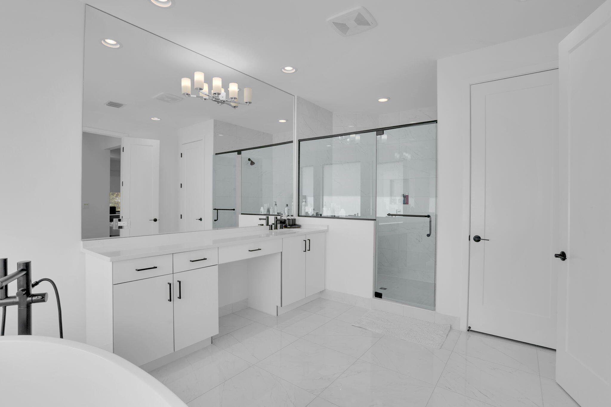 8115 Laurel Falls Drive Boca Raton, FL 33496 - Photo 36 of 74 a large bathroom with a sink a large mirror and shower