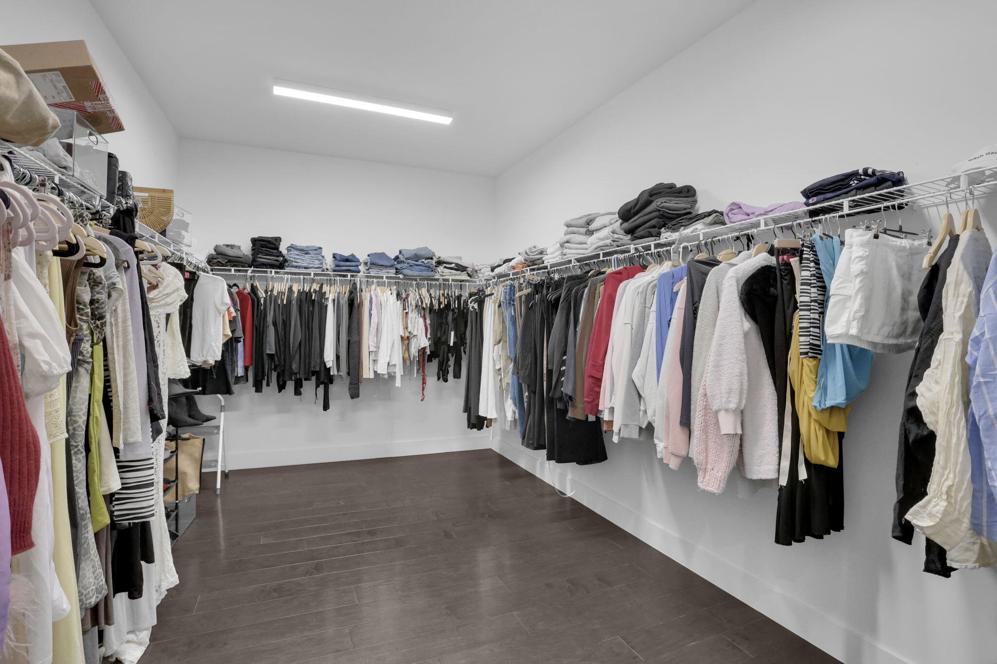 8115 Laurel Falls Drive Boca Raton, FL 33496 - Photo 39 of 74 a walk in closet with clothes and shoes