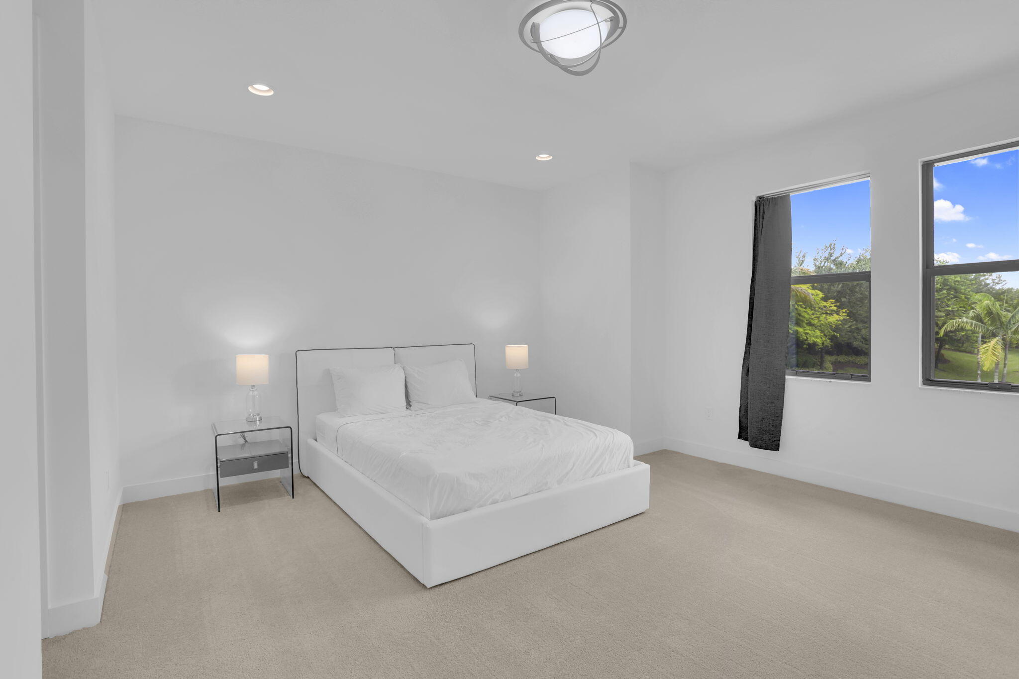 8115 Laurel Falls Drive Boca Raton, FL 33496 - Photo 40 of 74 a spacious bedroom with a bed and a large window