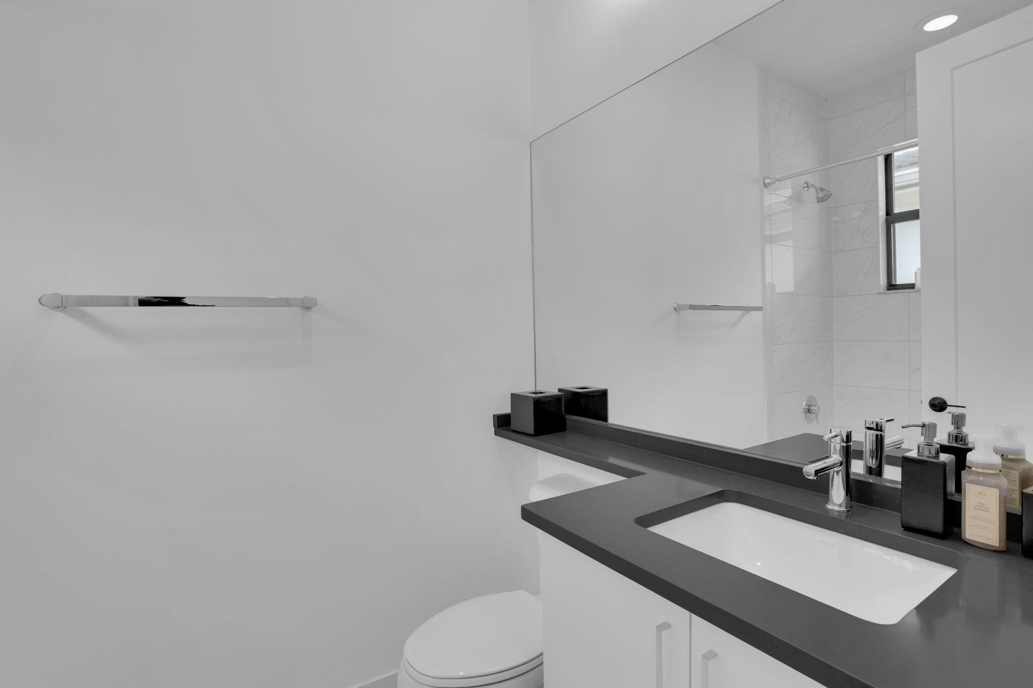 8115 Laurel Falls Drive Boca Raton, FL 33496 - Photo 50 of 74 a bathroom with a sink vanity mirror and toilet