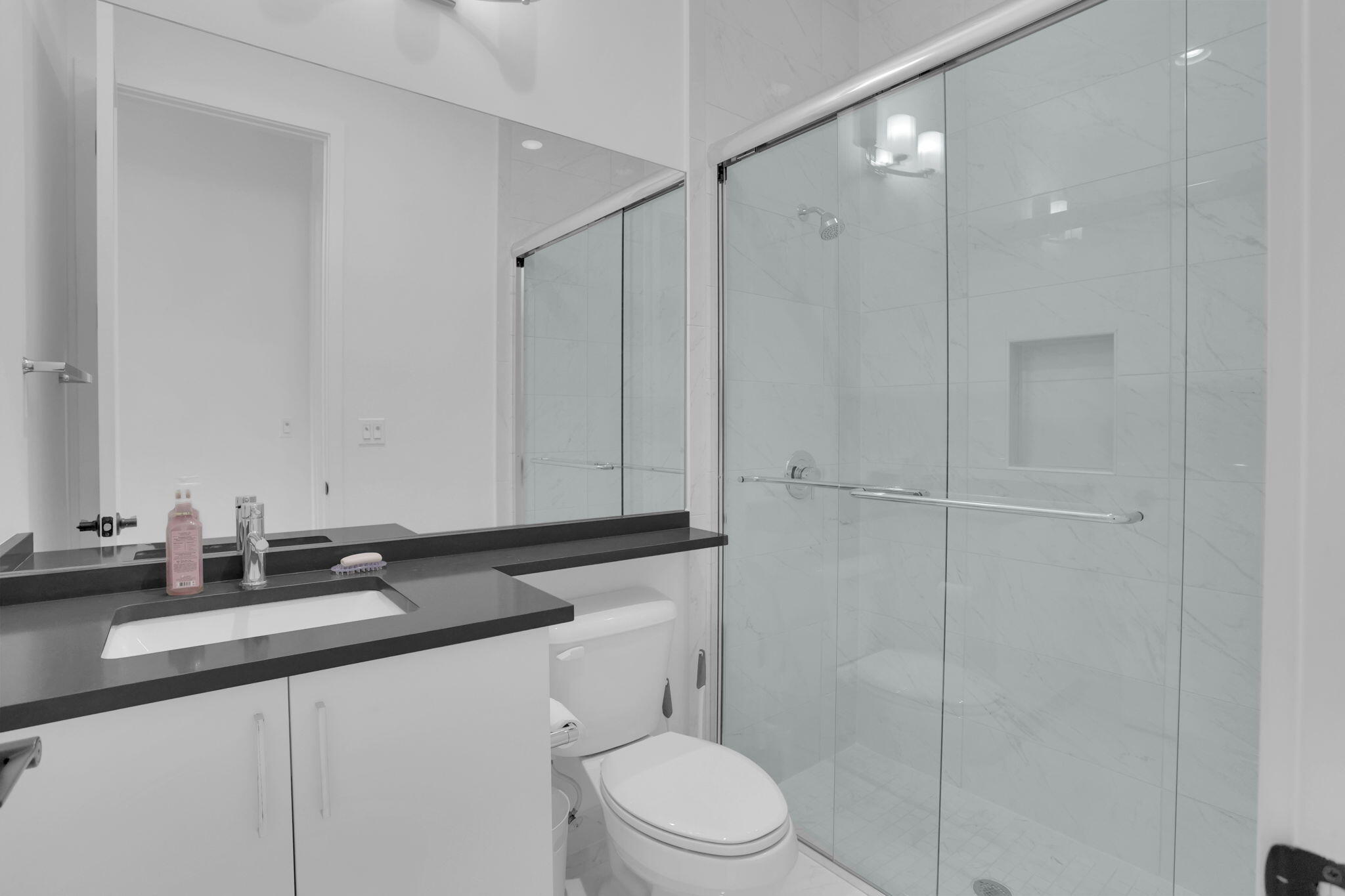 8115 Laurel Falls Drive Boca Raton, FL 33496 - Photo 52 of 74 a bathroom with a sink a toilet and shower