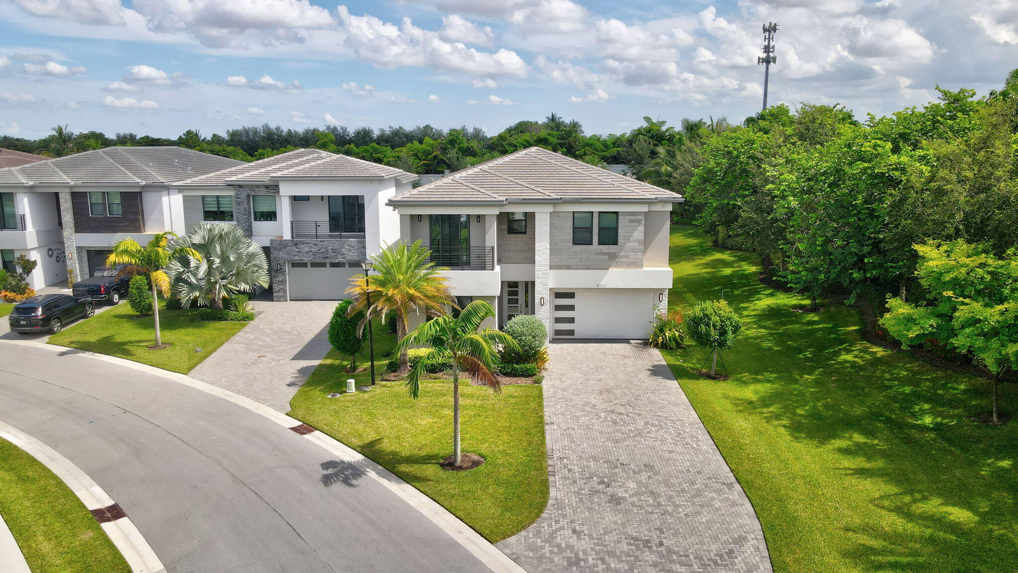 8115 Laurel Falls Drive Boca Raton, FL 33496 - Photo 53 of 74 a front view of a house with garden