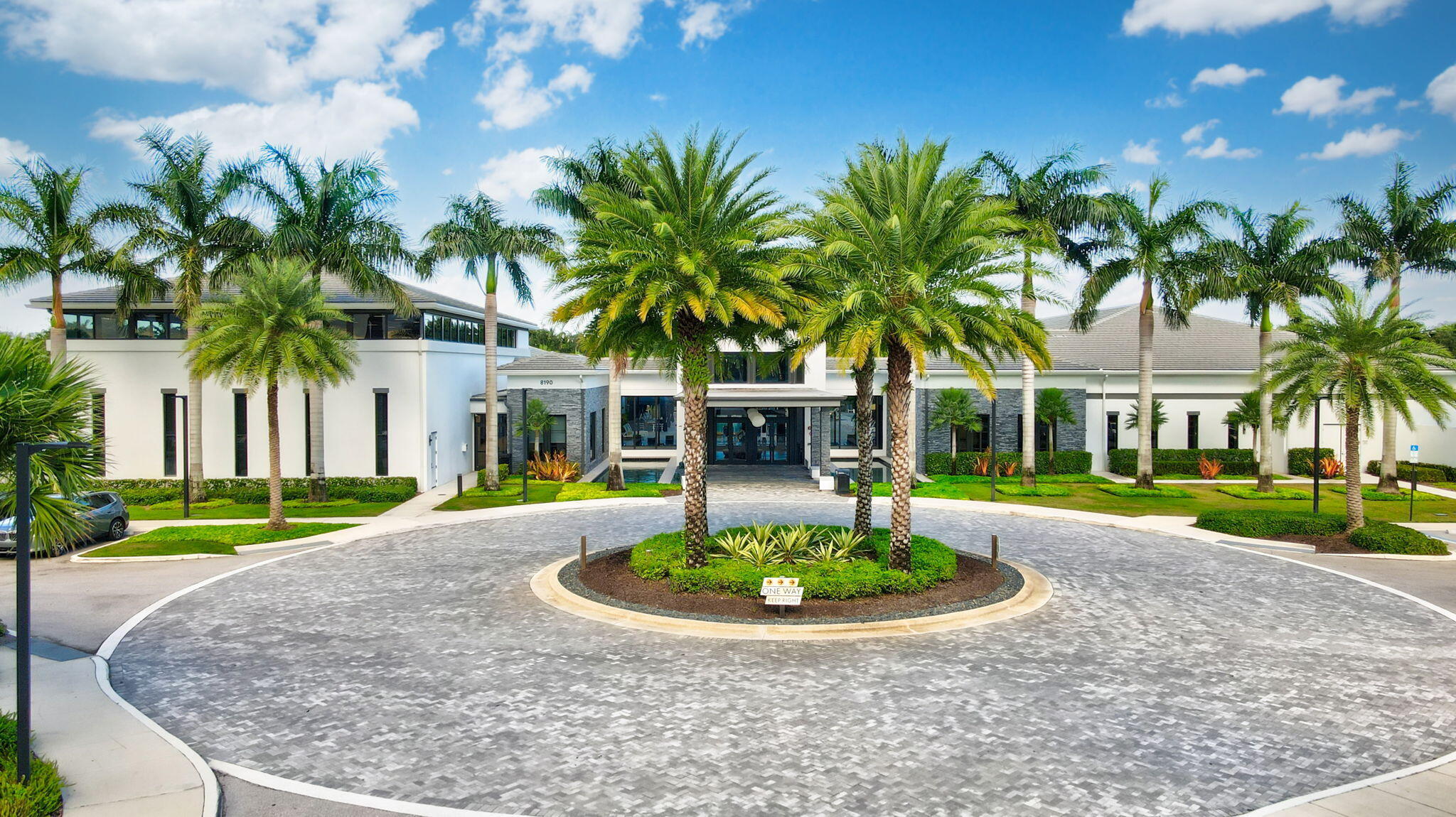 8115 Laurel Falls Drive Boca Raton, FL 33496 - Photo 65 of 74 a view of a house with a yard and palm trees
