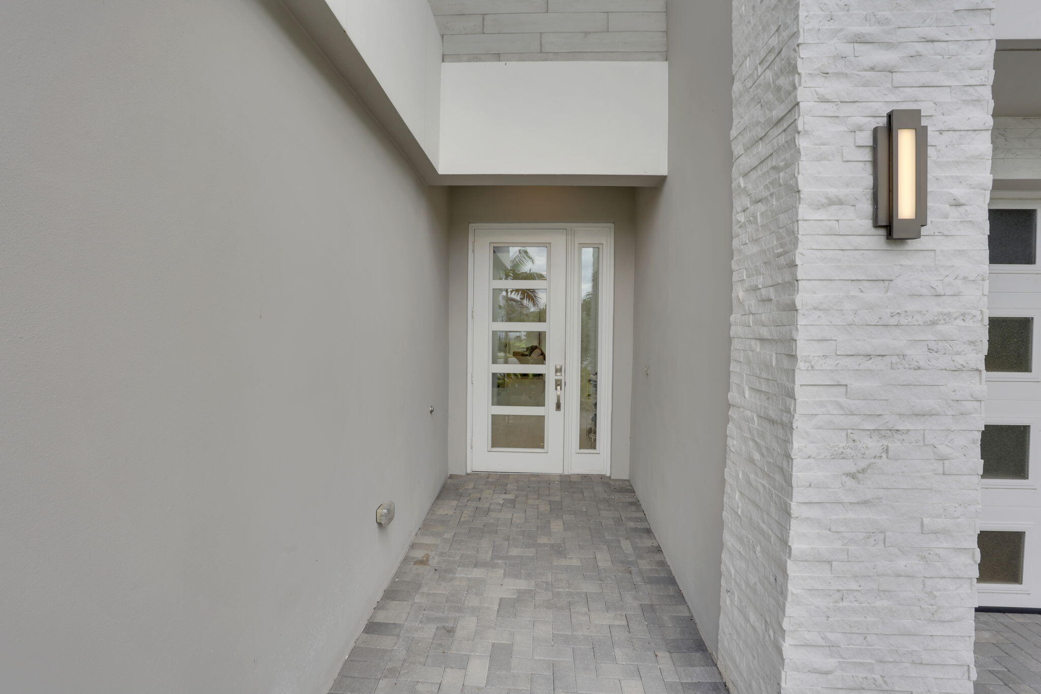 8115 Laurel Falls Drive Boca Raton, FL 33496 - Photo 7 of 74 a view of a hallway with wooden shelves