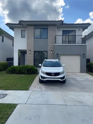 a car parked in front of a house
