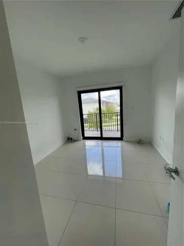 a view of a livingroom and a bathroom
