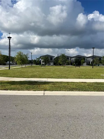 a view of a big building in a big yard