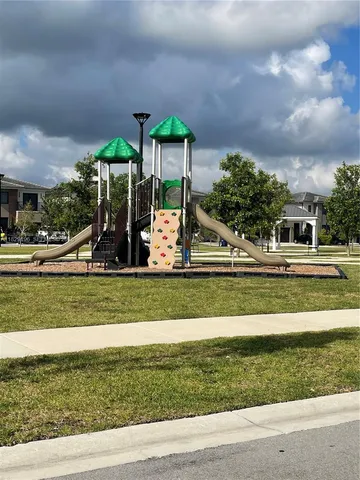a view of a park with swings and slides
