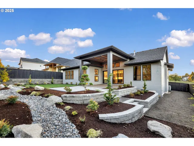 a front view of a house with garden