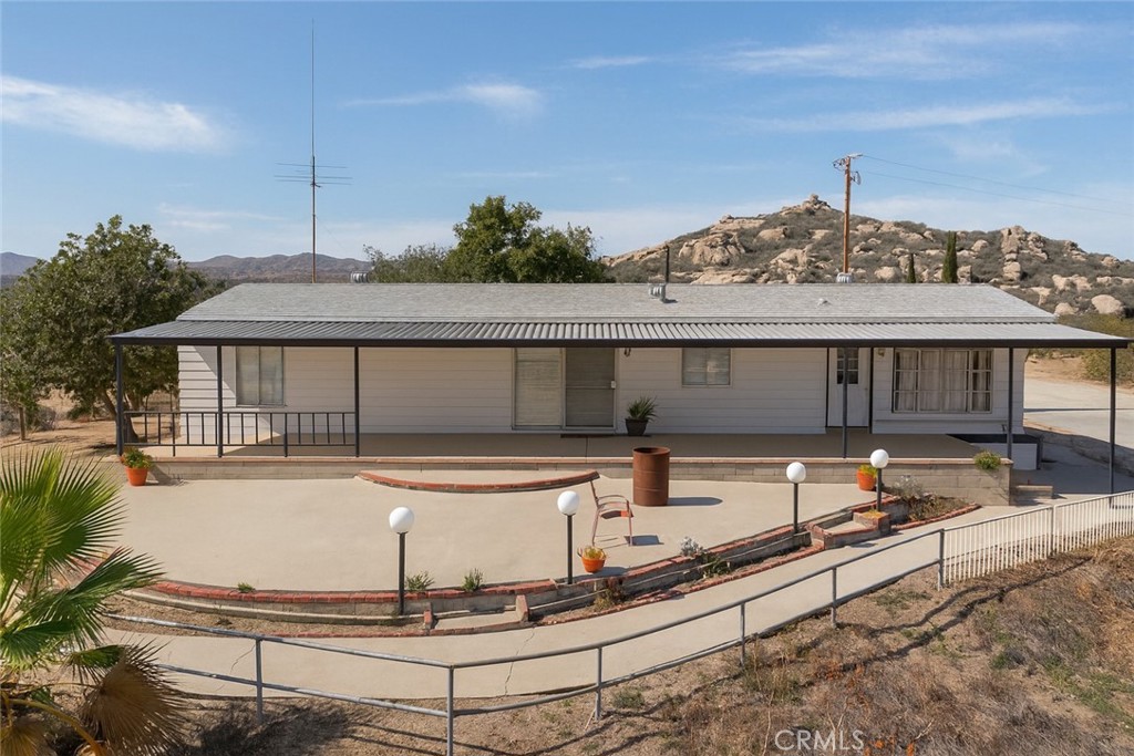 a front view of house with outdoor space