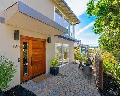a view of a patio with plants and table potted plants