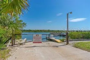 a view of swimming pool with outdoor seating