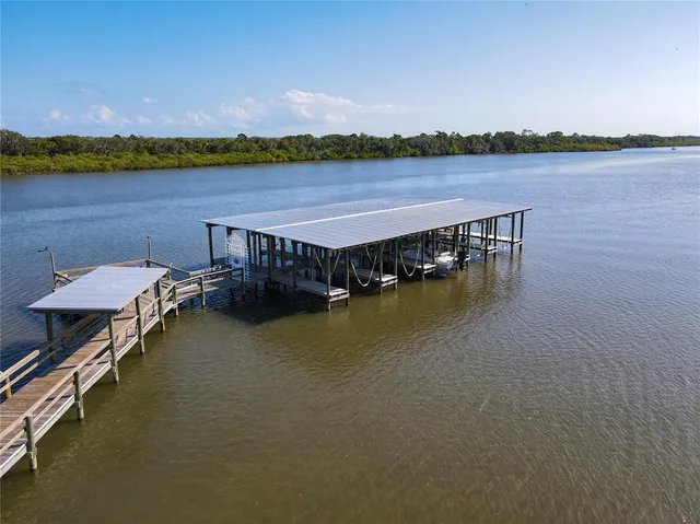an aerial view of a house with a lake view