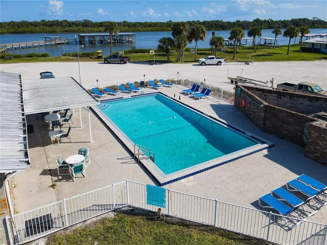 an aerial view of a house with a lake view