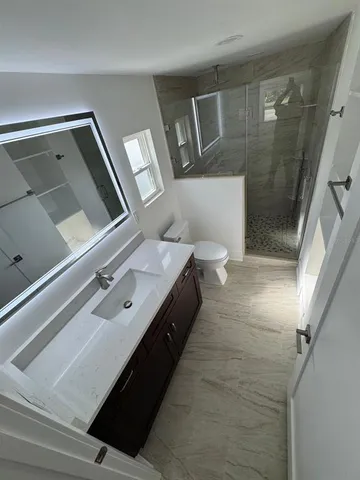 a bathroom with a sink and mirror