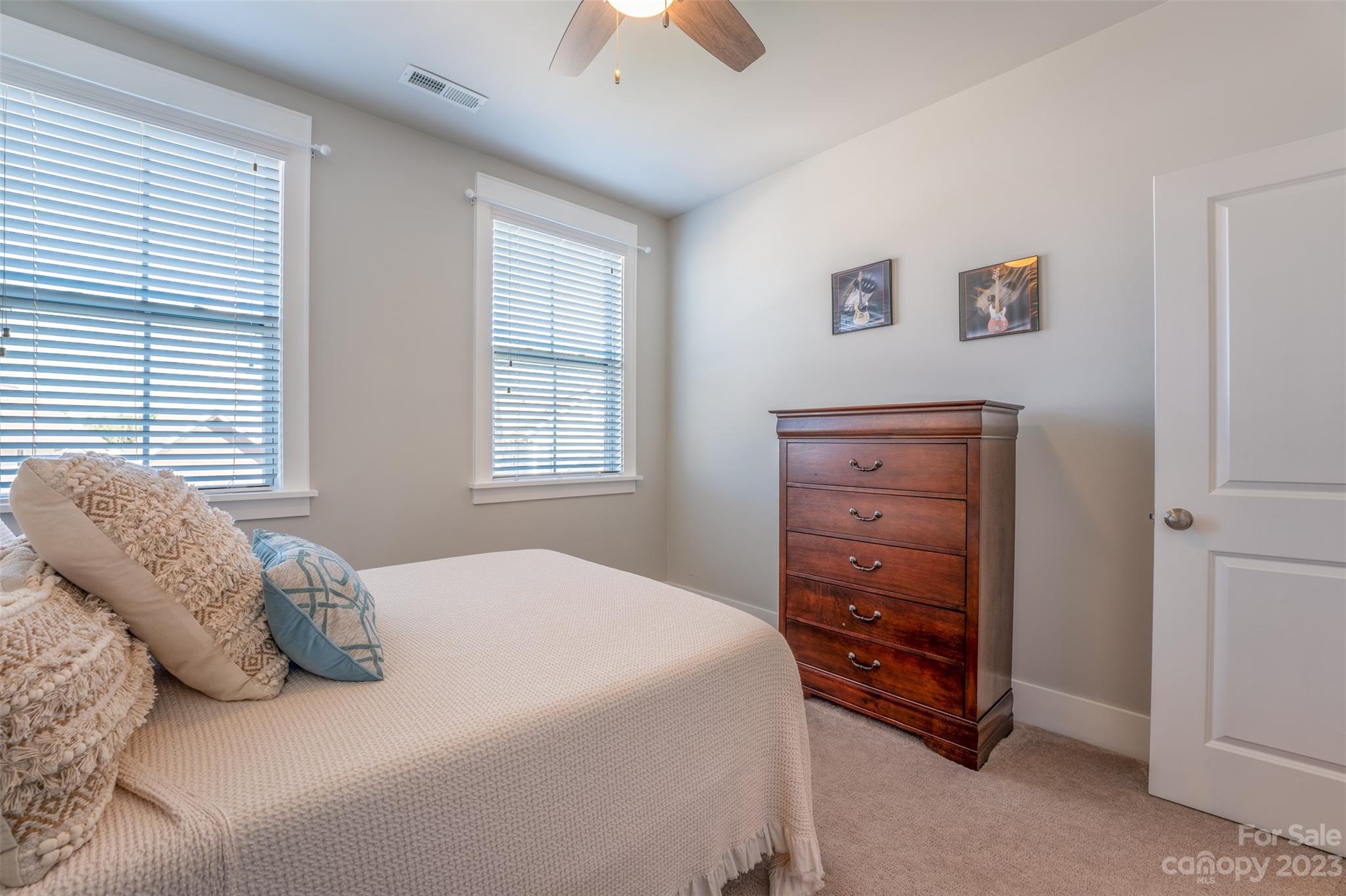 724 Bluff Loop Road Rock Hill, SC 29730 - Photo 24 of 45 a bedroom with a bed and a dresser
