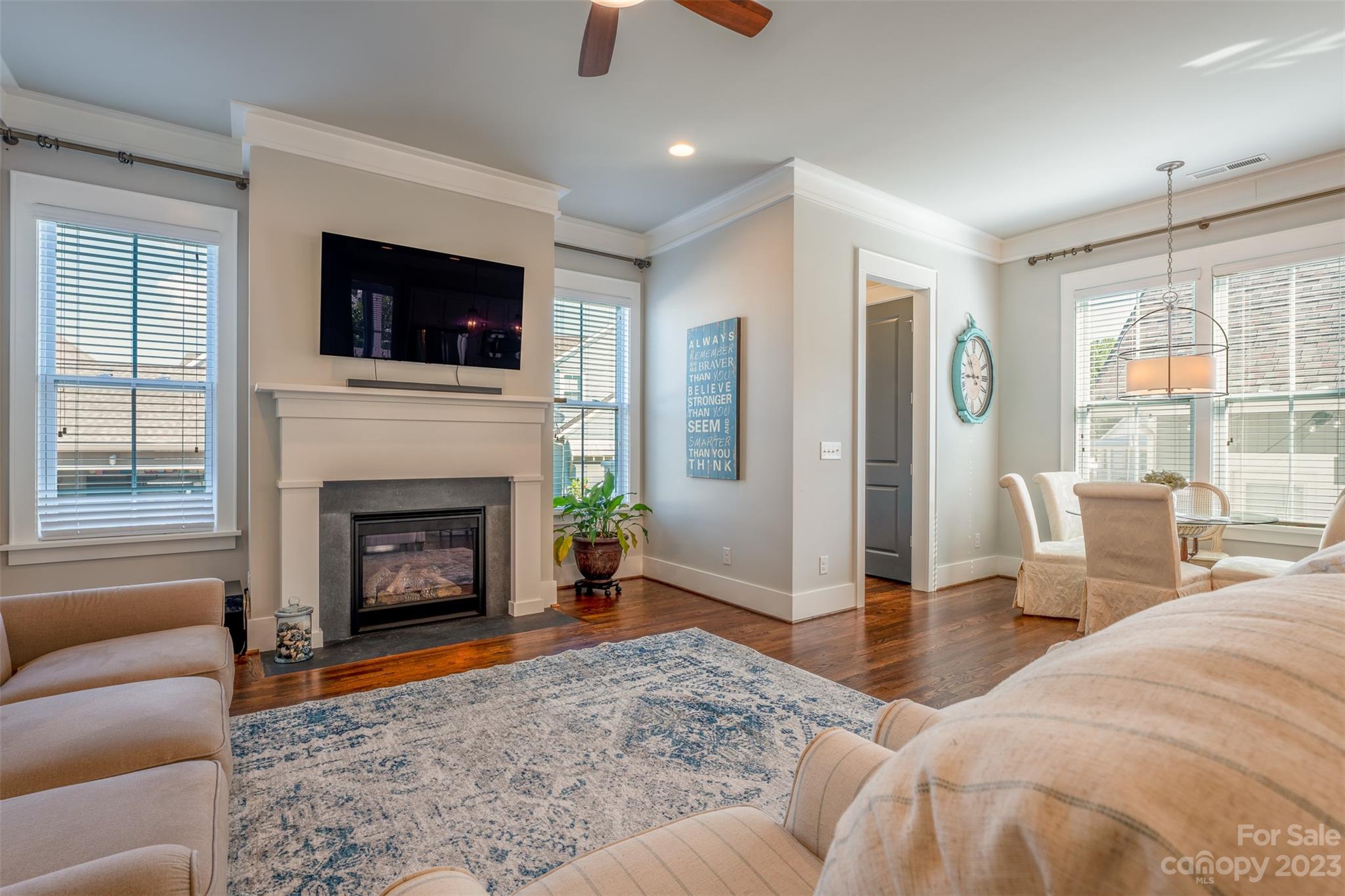 724 Bluff Loop Road Rock Hill, SC 29730 - Photo 8 of 45 a living room with furniture a flat screen tv and a fireplace