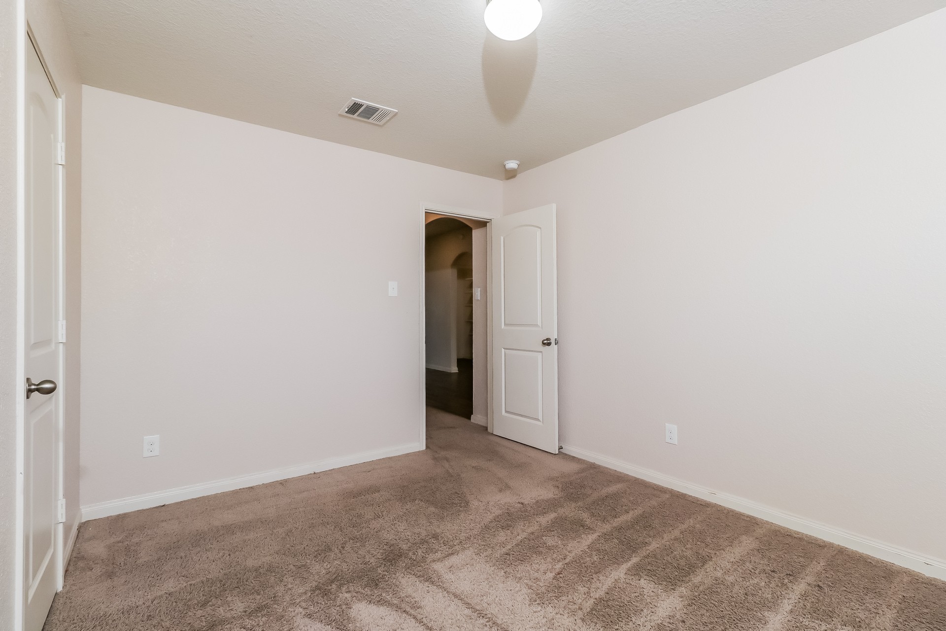 20017 Hubert R Humphrey Road Manor, TX 78653 - Photo 16 of 27 An inviting room featuring plush carpeting and a neutral color palette awaits your personal touch.
