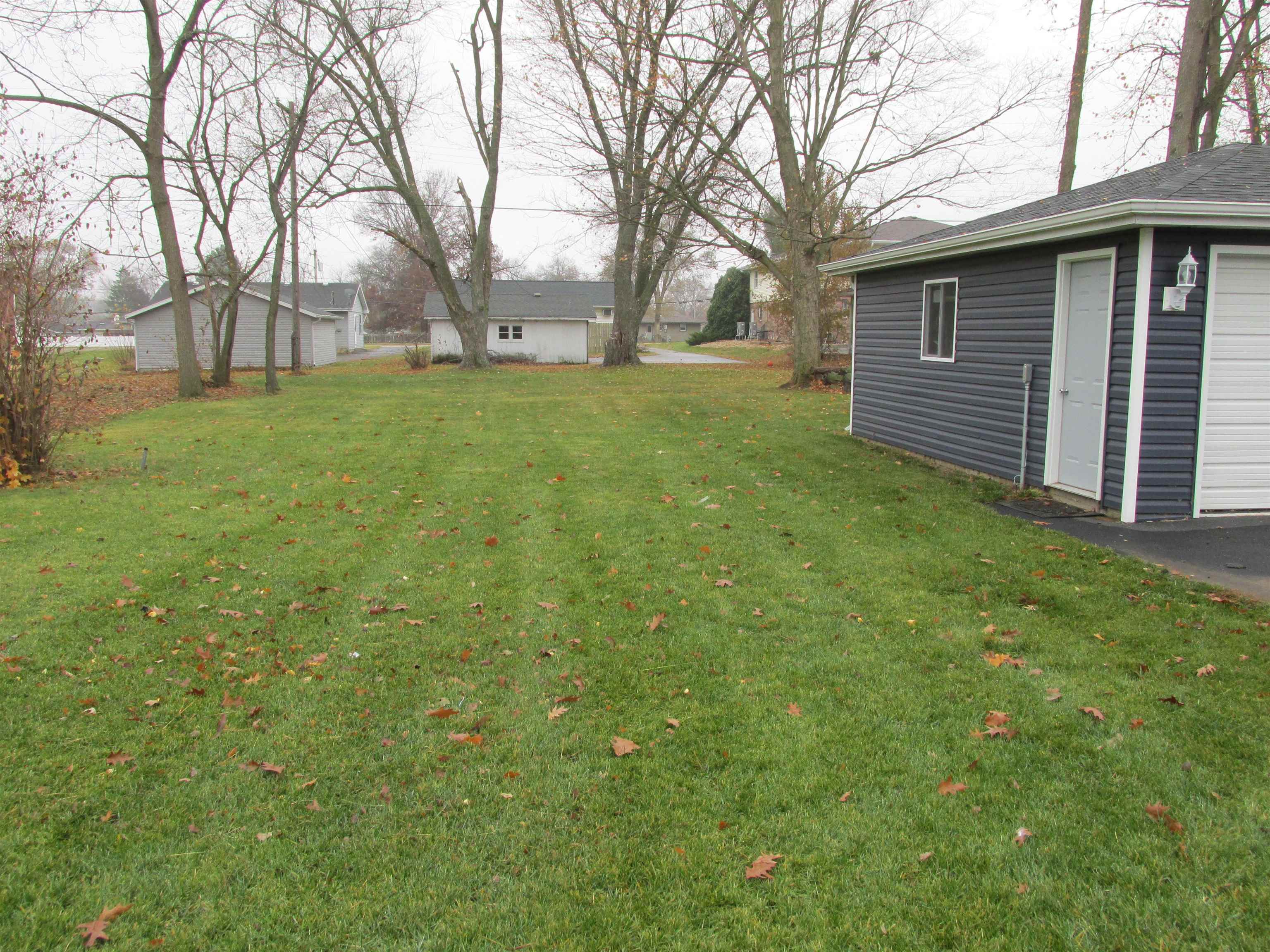 926 West 2nd Street Byron, IL 61010 - Photo 18 of 20 a view of a yard with a house