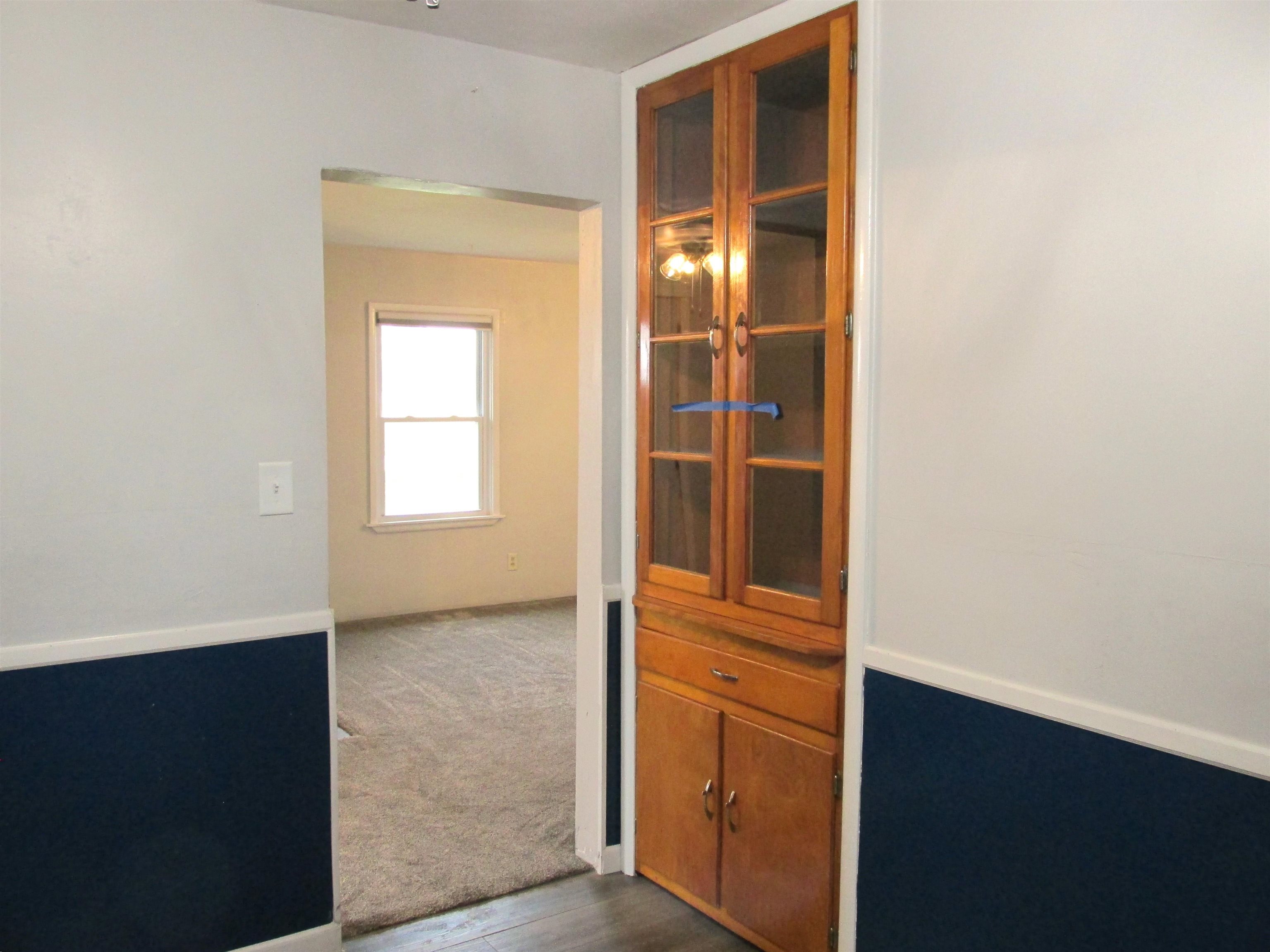 926 West 2nd Street Byron, IL 61010 - Photo 7 of 20 an empty room with windows