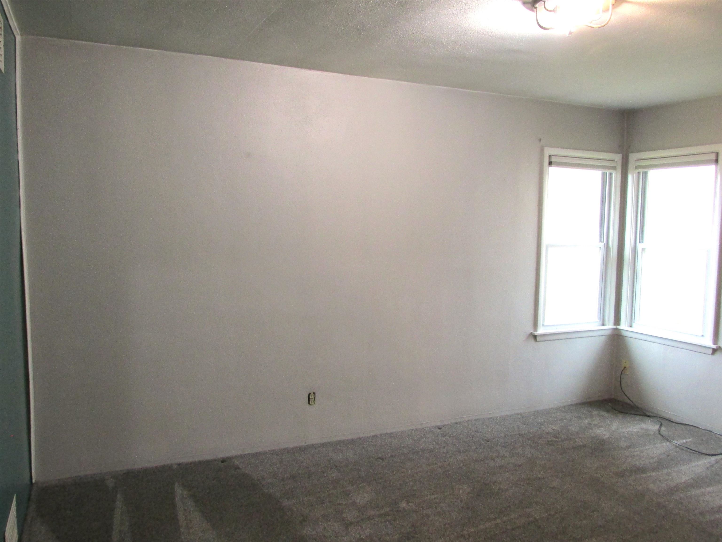 926 West 2nd Street Byron, IL 61010 - Photo 8 of 20 an empty room with windows