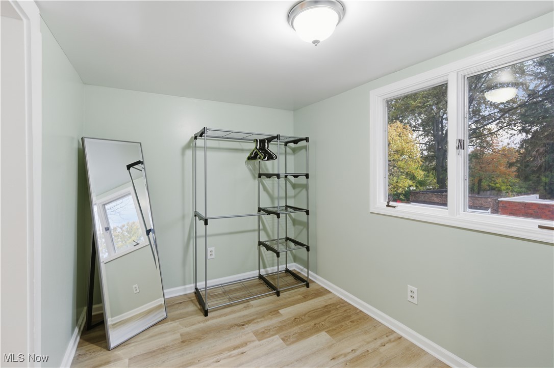 1017 Spring Road Cleveland, OH 44109 - Photo 22 of 47 Unfurnished bedroom featuring light wood-type flooring and baseboards