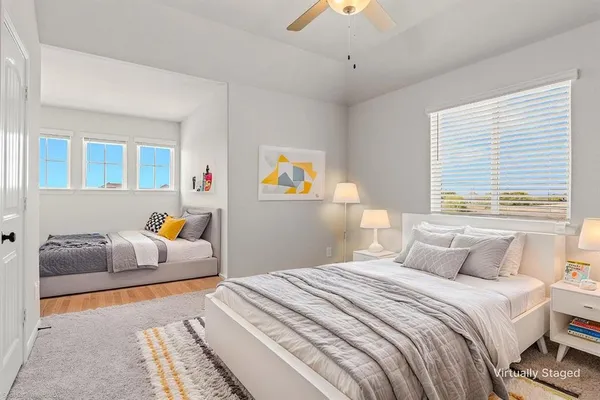 a bedroom with bed and window