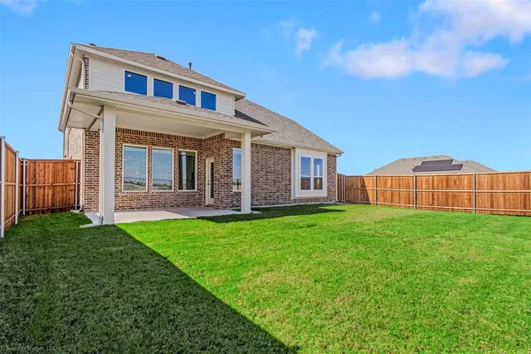 a front view of a house with yard