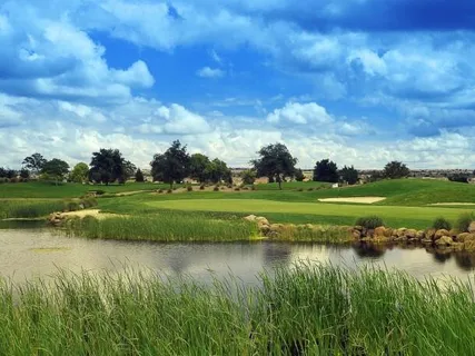 a view of a lake with a big yard