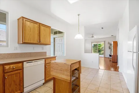a kitchen with a refrigerator and countertop
