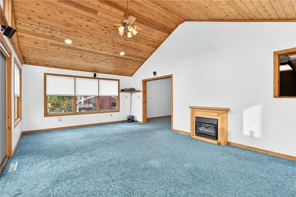 a view of empty room with a fireplace
