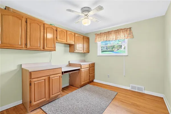a kitchen with stainless steel appliances granite countertop a stove a sink and dishwasher with wooden cabinets
